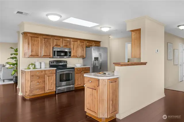 Custom cherry cabinets with solid surface counters and newer stainless steel appliances