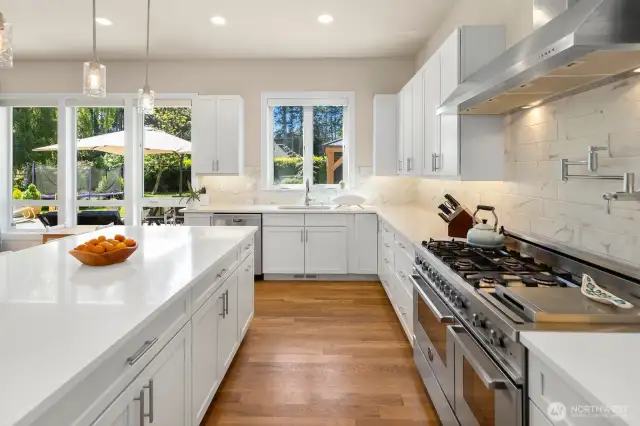 Thoughtful design touches abound, like a backyard view from the sink, and pot-filler at the range.