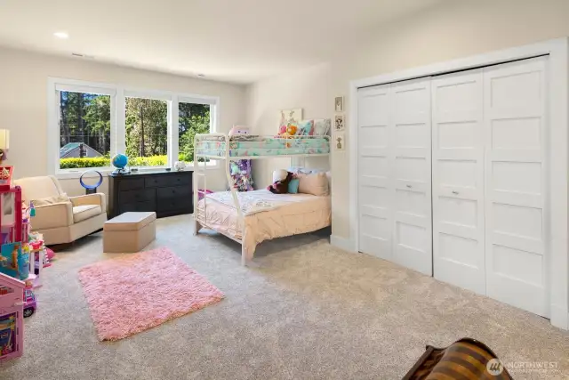 Another oversized bedroom on the upper floor - with space galore, this one overlooks the backyard and has en-suite connection to the hall bathroom.
