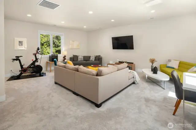 Huge bonus room over the garage gives you even more flex-space options - the current setup gives space to relax with a movie, work from home, and even exercise.