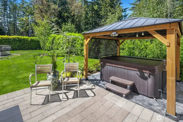 This sanctuary includes the hot tub and pergola for ultimate relaxation.
