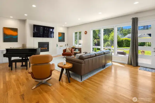 The open floor plan has plenty of space for all the features of your modern life. Cozy gas fireplace, built-in cabinets, and feature walls for your art collection.