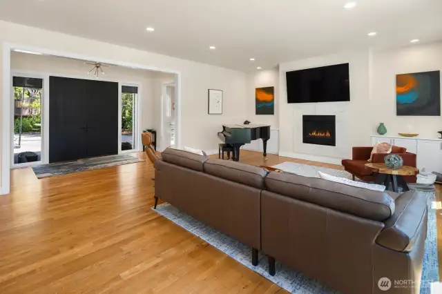 Looking back toward the front entry, with the powder room conveniently tucked away to the right of the doors.