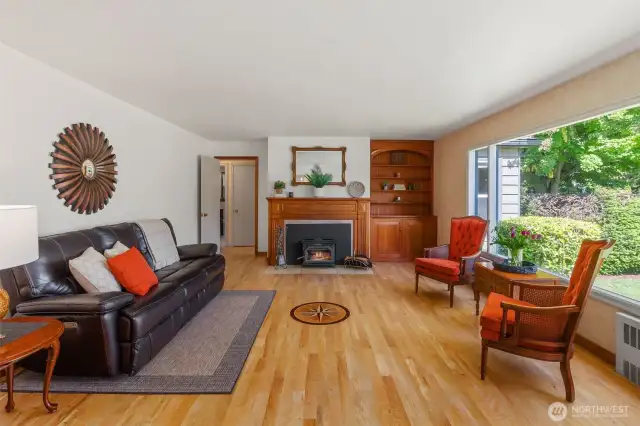 Gorgeous handcrafted sweet gum hardwood floors with compass rose and built in mahogany bookcase. Trim and baseboards are mahogany as well.