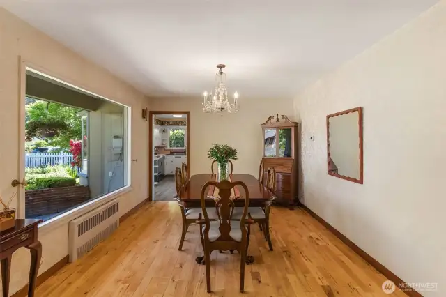 Additional windows in the spacious dining room continue to flood this home with natural light.