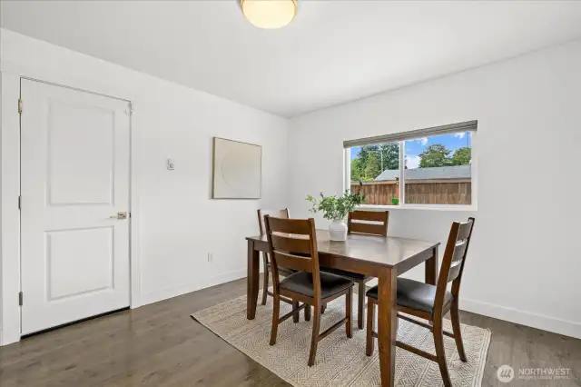 Spacious Dining Area with Functional Flow to Kitchen and Garage.