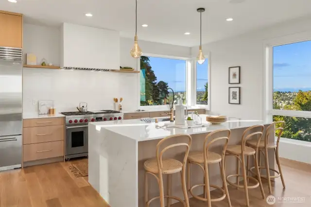 Chef's kitchen with 48" Wolf stove w/double oven and 48" Subzero refrigerator.