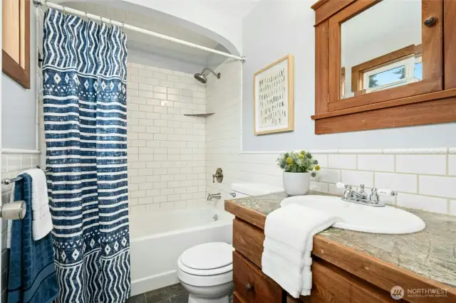 Primary full bathroom with custom touches throughout.