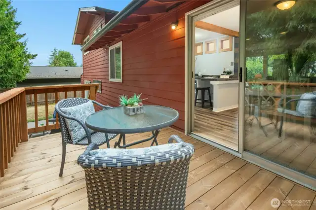 Peaceful deck and fully fenced backyard surrounded by nature