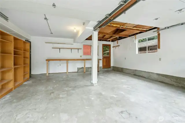 Two car garage with room for workspace and storage above and to the side!