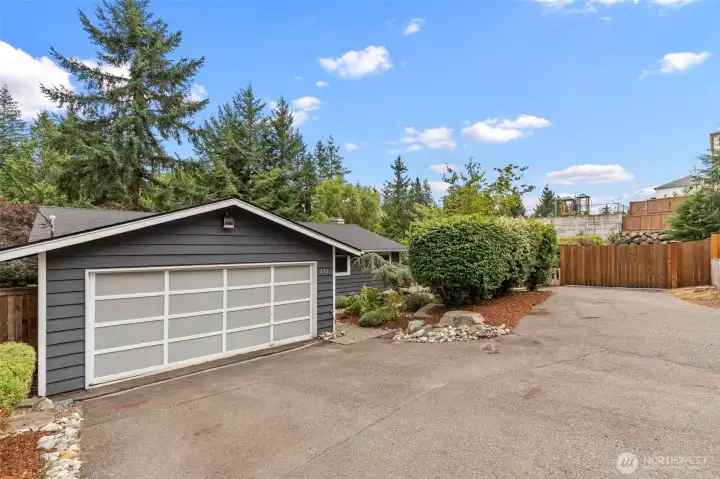 Angled view of the sweeping driveway and front yard.