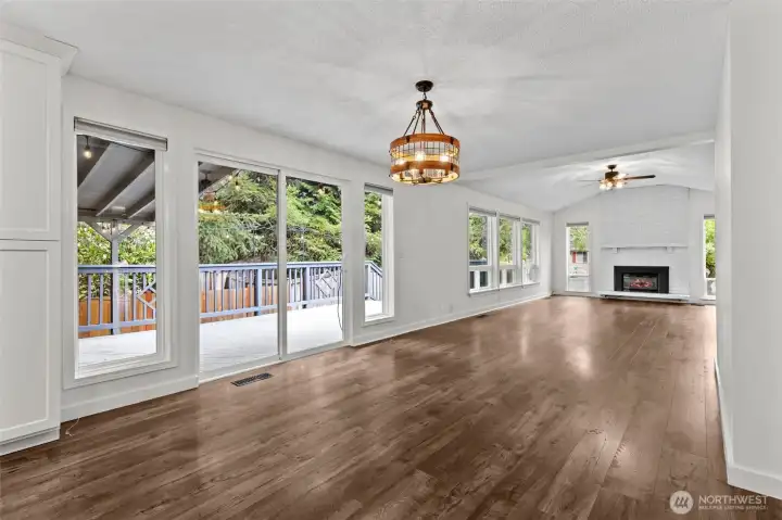 Dining area beside sliders that open to the covered deck.
