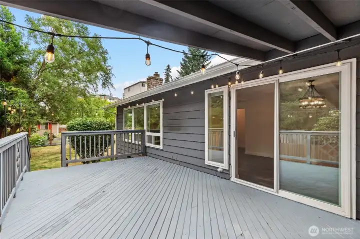 Deck outside sliders overlooking the level backyard.