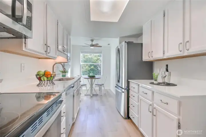 What a delightful area for cooking and morning coffee!