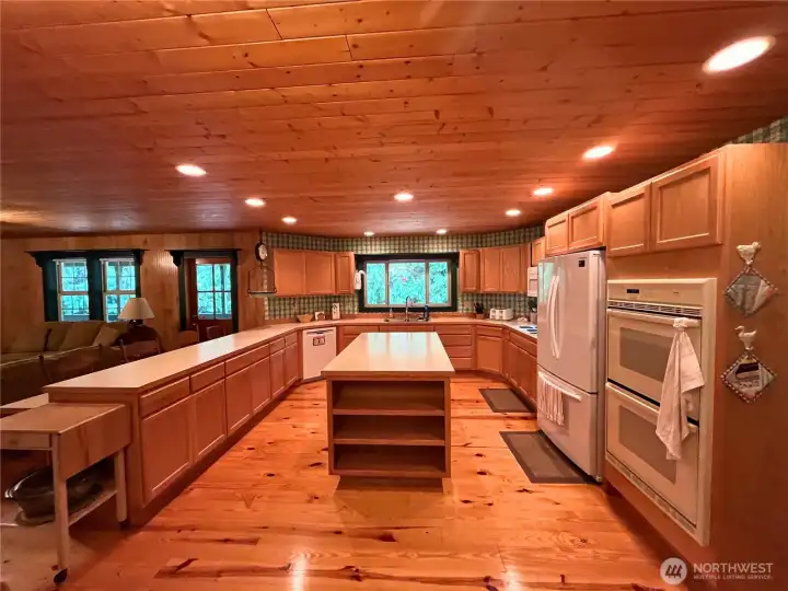 Kitchen with double oven and new appliances.