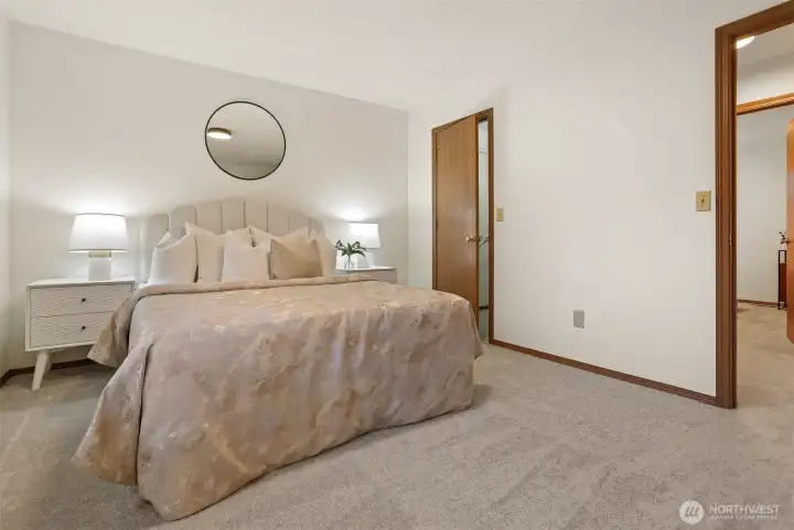 Primary bedroom looking to walk-in-closet.