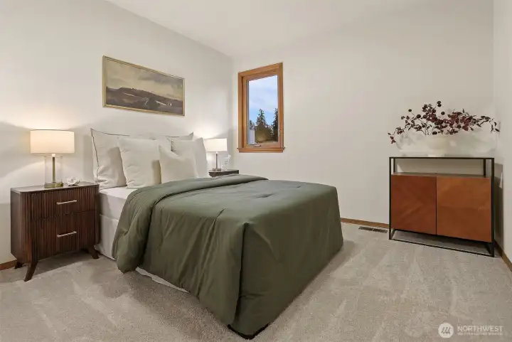 One of two large upper level bedrooms.