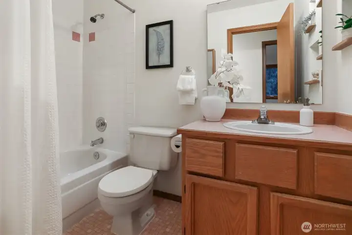 Ceramic upper level hall bath.