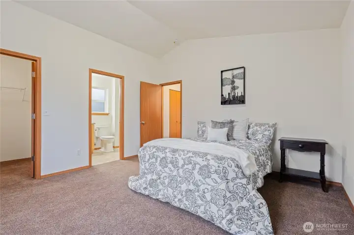 Light Filled Room with Walk-In Closet, Vaulted Ceilings and En-Suite Bathroom.