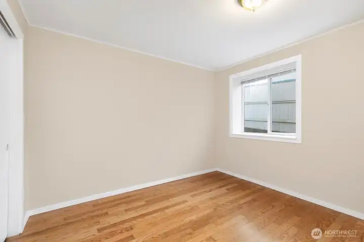 Lower Unit bedroom #3 also featuring hardwood flooring.
