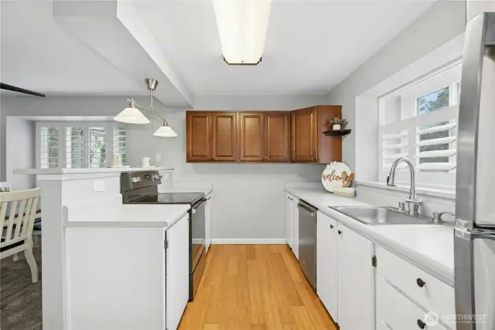 The open kitchen connects seamlessly to the dining area