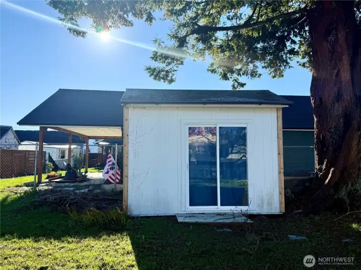 This little shed holds the washer and dryer plus work space and storage
