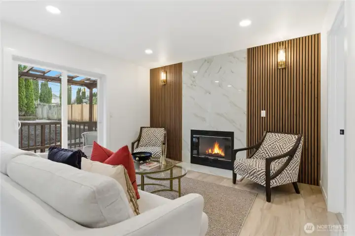 Family room / with wood panels and fireplace