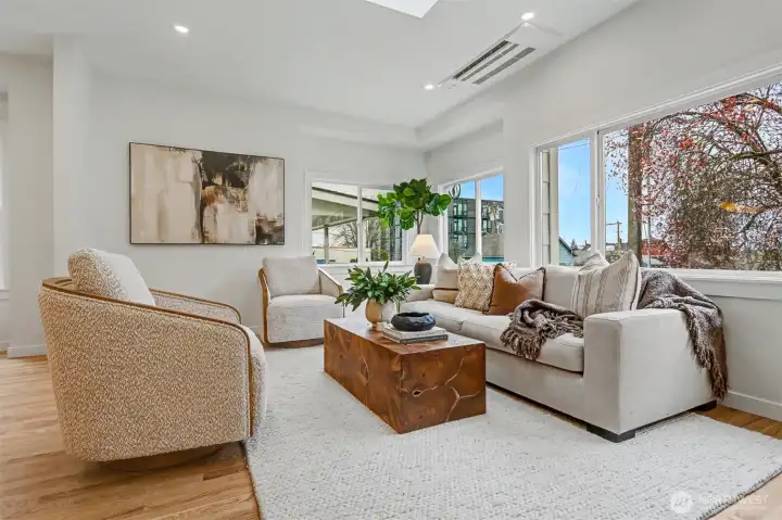 Living room surrounded by windows