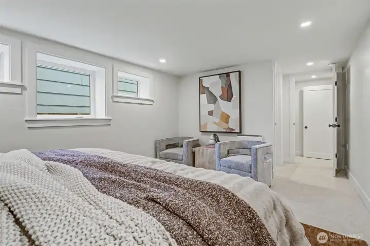 Primary bedroom looking towards the door and walk-in closet.