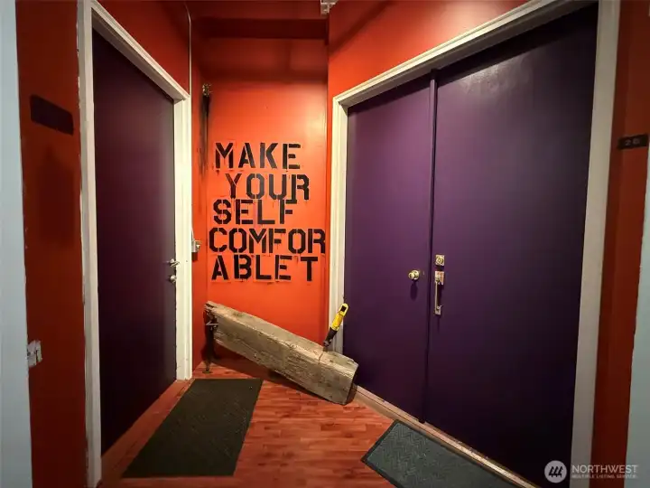 Two doors, studio on the left and apartment on the right.