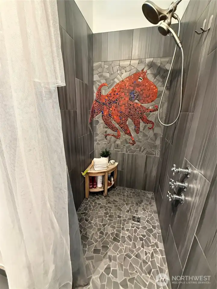 Amazing artist-created octopus tiled shower!