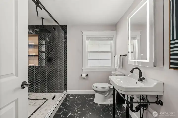 In the hallway, you'll find the most beautiful bathroom I've ever seen