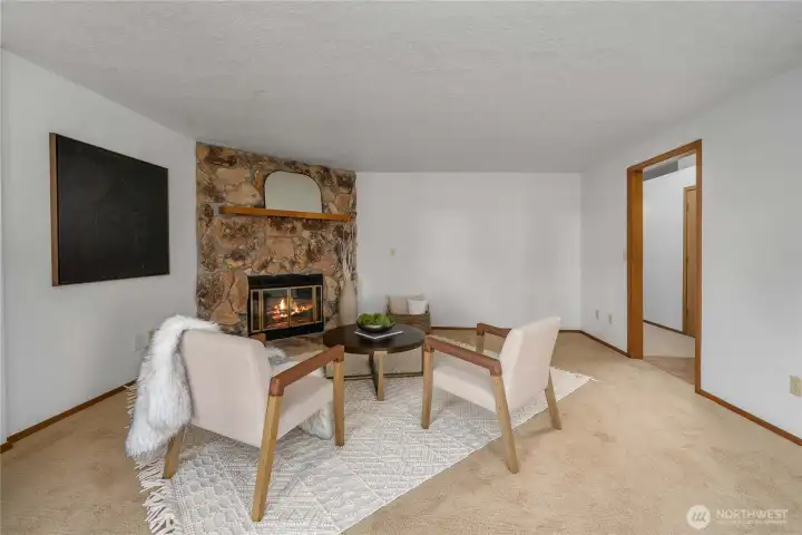 The cozy, stone-faced gas fireplace is the focal point of the livingroom.