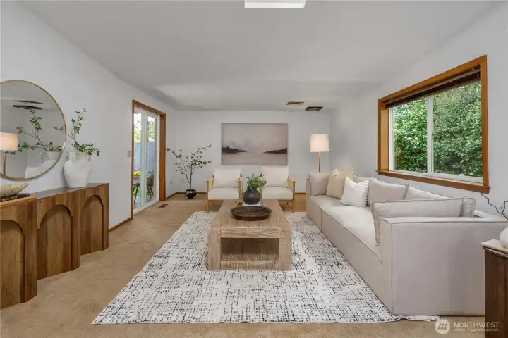 You can spread out easily in this sizeable family room with vaulted ceilings and skylight.