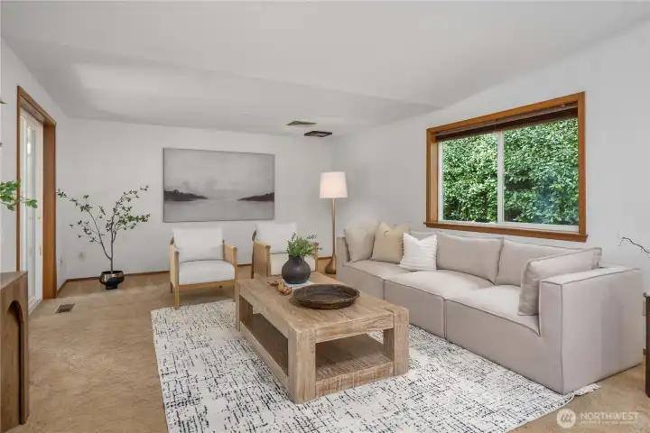 The sliding glass doors lead to the covered back deck