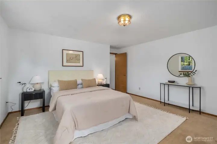 The primary bedroom has plenty of space for a king-sized bed