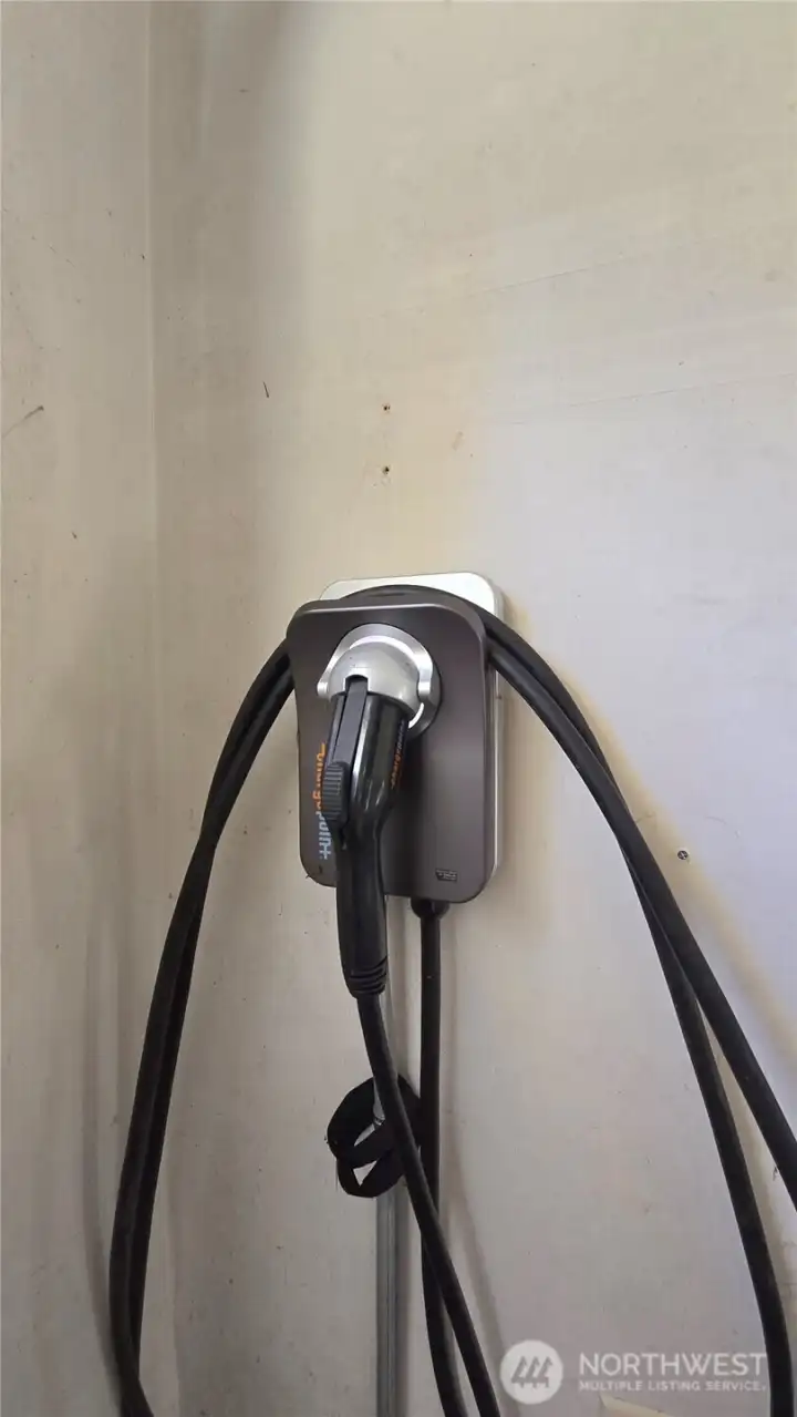 The EV charger in the garage is ready for your electric vehicle