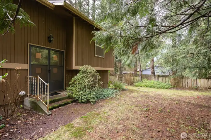 The home is set back from the road with towering evergreens giving it much privacy.