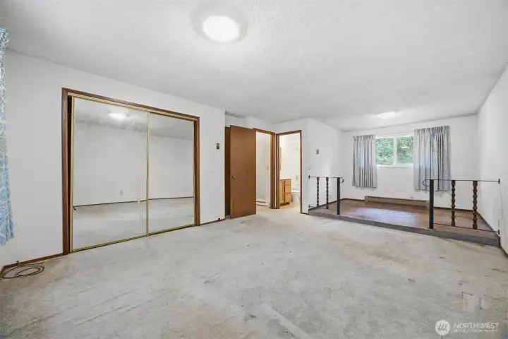 Another view of the primary bedroom with the full bath.