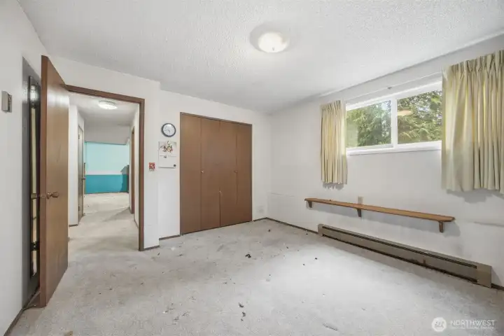 The second bedroom is quite large and is adjacent to the laundry room and 3/4 bath.