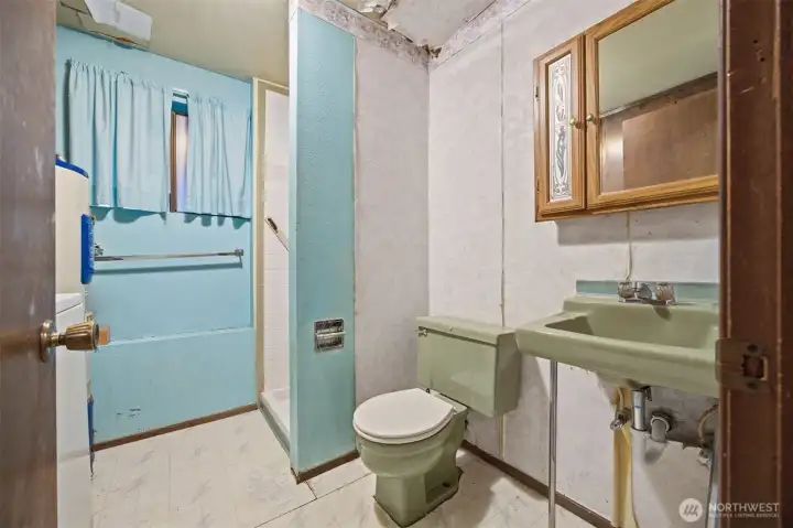 Looking at the 3/4 bath and laundry room which is on the lower level.