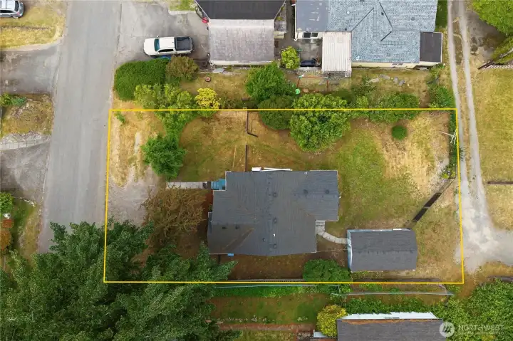 Aerial view showing alley access to garage.