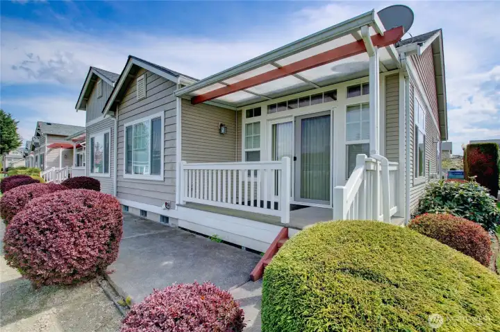 Covered back deck connects to living room by sliding glass doors.