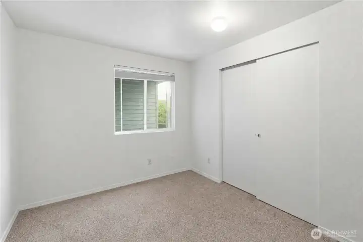 Third bedroom with a new carpet