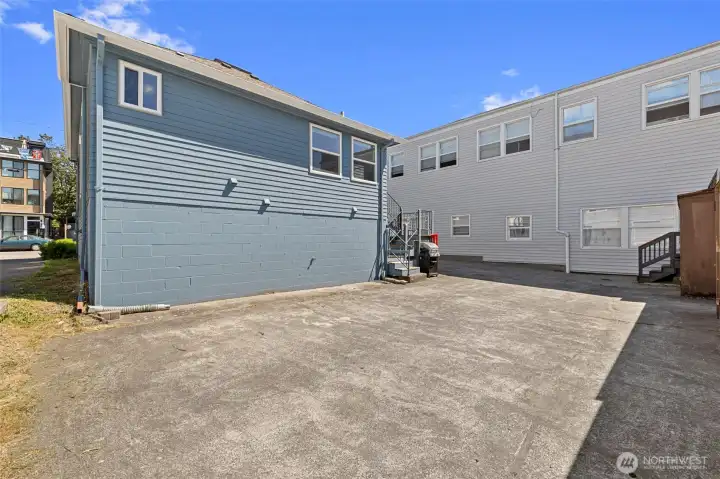 Back view of house with parking