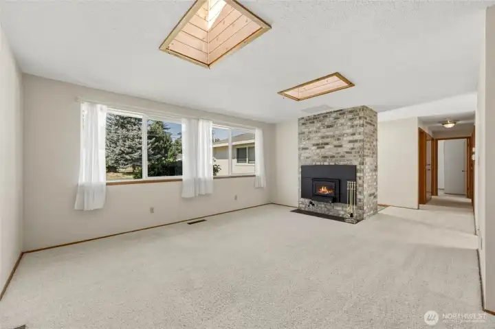 The wood-burning fireplace with insert creates a warm focal point.