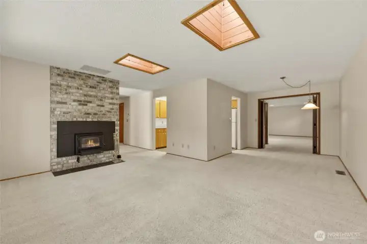 Spacious living room flows seamlessly into the formal dining room.