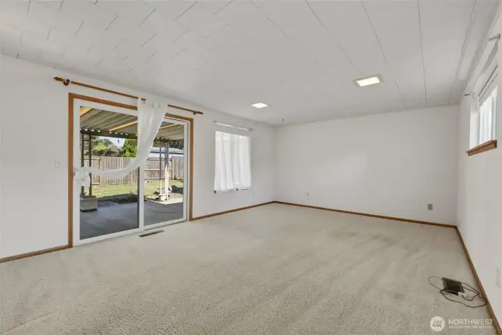 Light-filled family room opens to the covered patio.