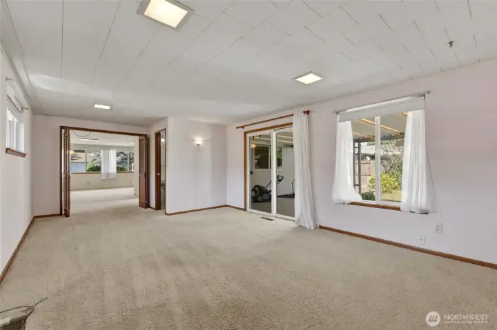 Sliding glass door provides easy access to the covered patio and backyard