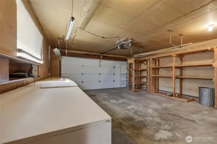 Built-in shelving provides exceptional workshop and storage space.